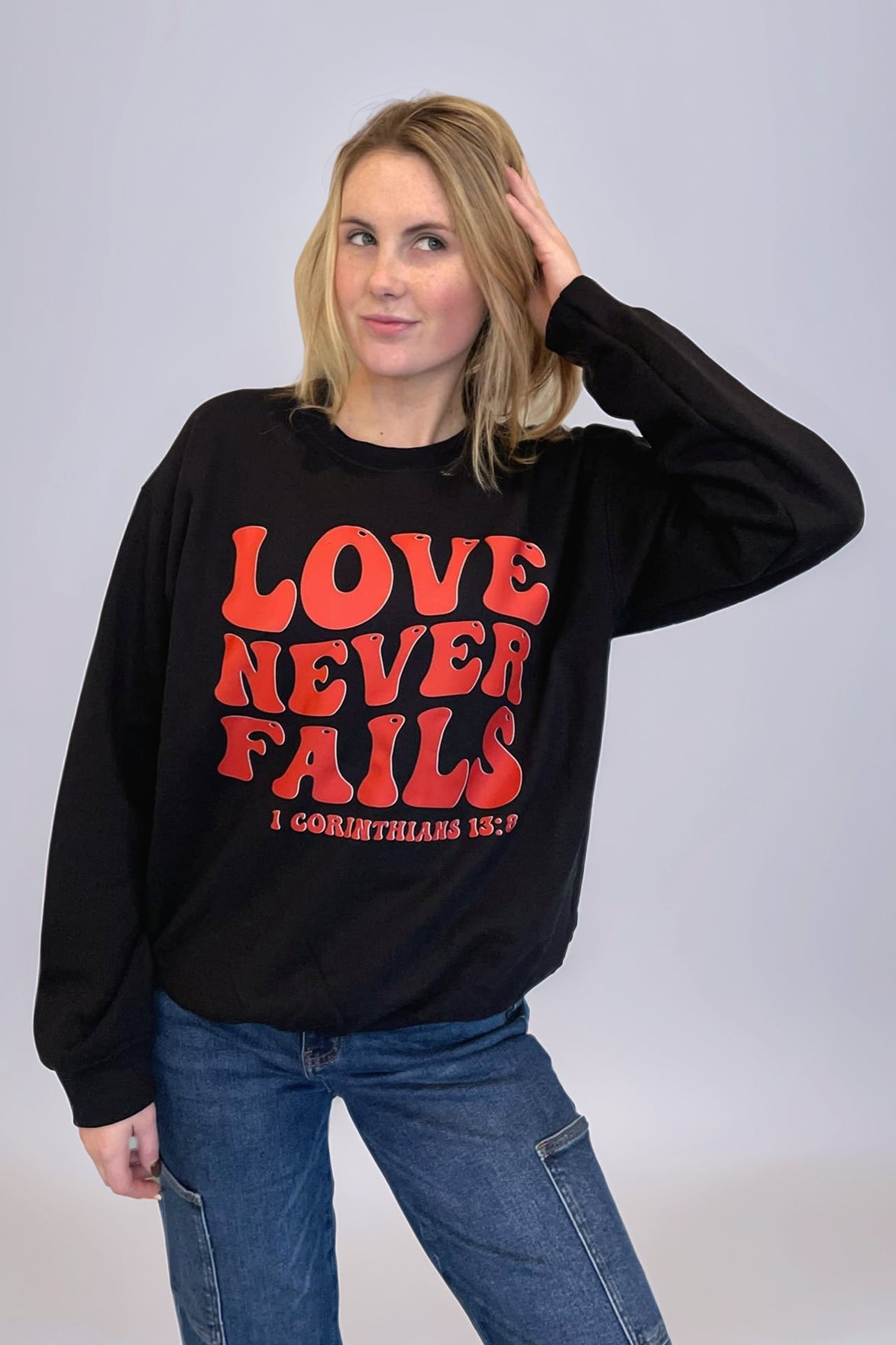 Love Never Fails Sweatshirt